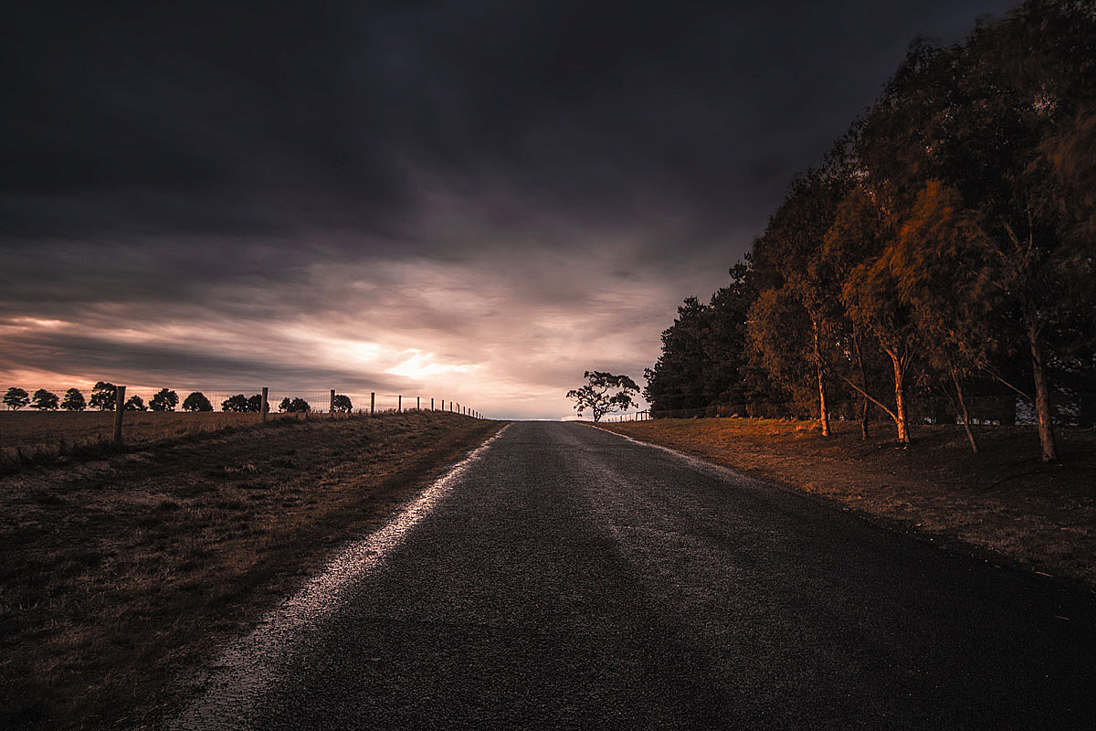 landscape photography, winter sunset, late afternoon rain clouds, wet country road, Geelong, Victoria, Australia